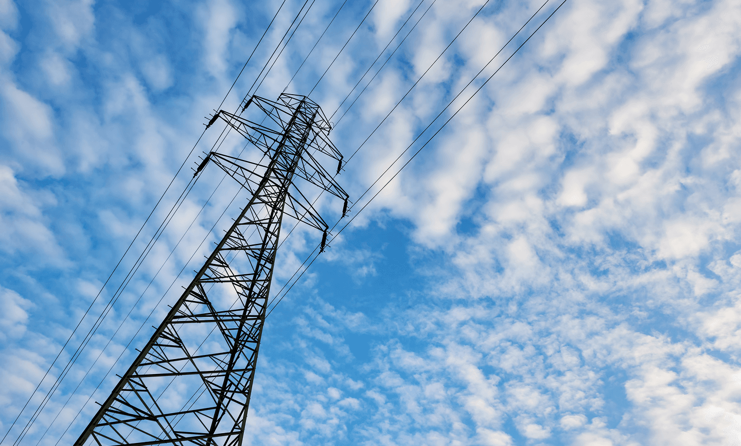 Electrical transmission tower against gradient sky